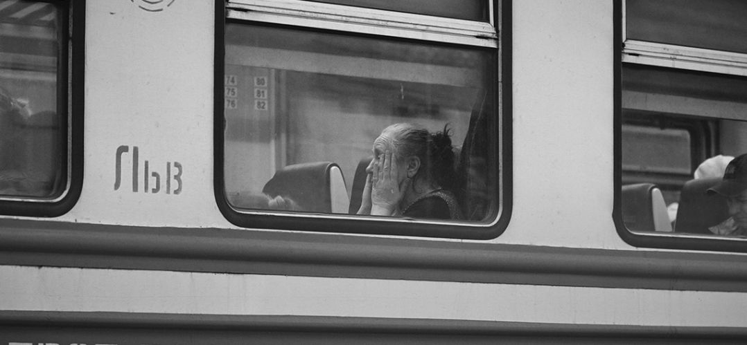 Refugee coming to the Uk through the window of a train