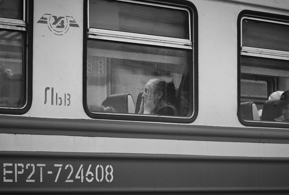 Refugee coming to the Uk through the window of a train